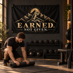 Earned. Not Given Banner in a styled lifestyle setting, with two grommets on one short edge; illustrative mockup.