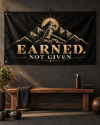 Earned. Not Given Banner displayed in a styled interior; illustrative mockup.
