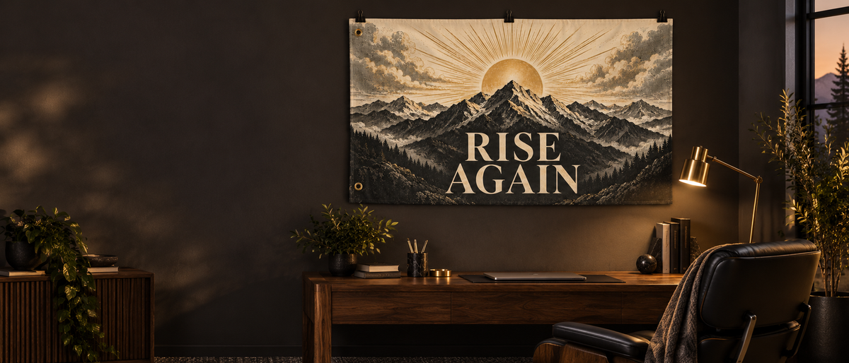Rise Again banner displayed above a walnut desk in a warm charcoal interior; styled mockup.