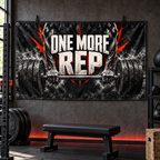 One More Rep Banner in a styled gym; illustrative mockup with two grommets along the left short edge. Display clips and props not included.